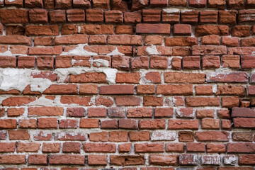 old brick wall.
Old brickwork of the destroyed house of the 18th century