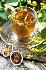 Glass of herbal tea with linden flowers