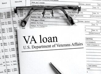 Paper with text VA Loan U.S. Department of Veterans Affairs on a table