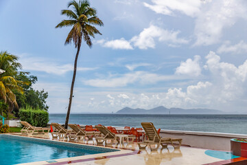 Bequia view with palm in foreground from Saint Vincent, Saint Vincent and the Grenadines