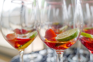 Selected focus at preparation of  Triple Berry Margaritas or Berry Vodka Cocktails with strawberries, blueberry, blackberry and lime serve on glass with salt on top. 