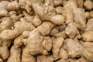raw flavored ginger in the market close up