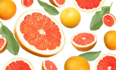 Levitation of whole grapefruit and slices on a white background with selective focus. Banner, wallpaper, advertising.