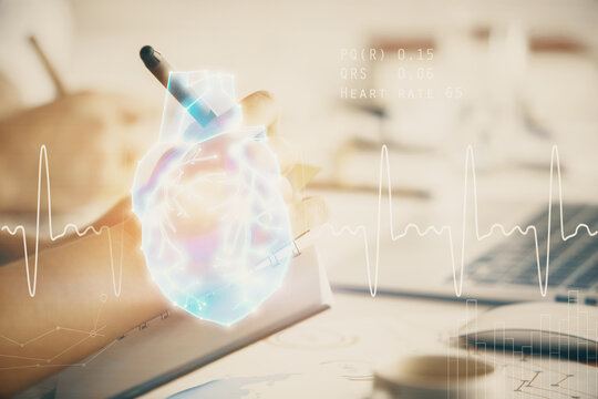Double exposure of heart drawing over people taking notes background. Concept of medical education