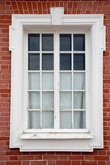 Window on the red brick wall old building
