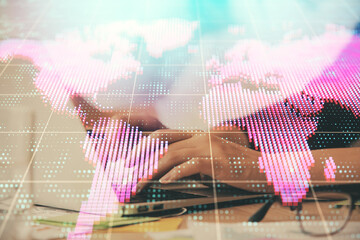 Multi exposure of woman hands typing on computer and business theme hologram drawing. Success...