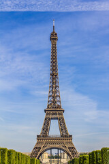 Fototapeta premium Eiffel Tower (La Tour Eiffel) located on Champ de Mars in Paris, named after engineer Gustave Eiffel. Eiffel Tower is tallest structure in Paris and most visited monument in world. Paris, France.