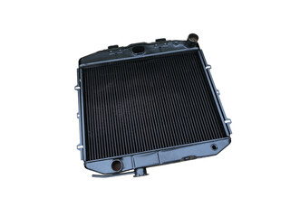New copper car radiator car cooling system on an isolated white background. Spare parts.