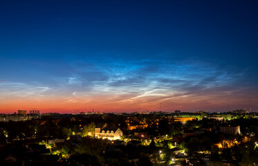Sunrise Cityscape. Beautiful sky and clouds, night illumination of houses. Vladimir city, Russia