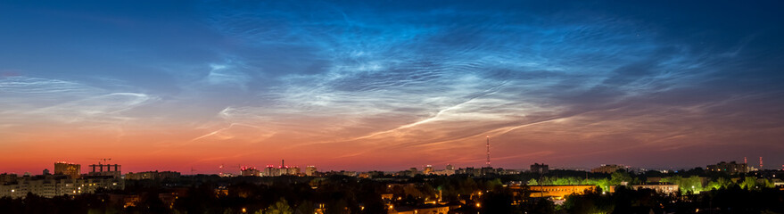 Sunrise Cityscape. Beautiful sky and clouds, night illumination of houses. Vladimir city, Russia