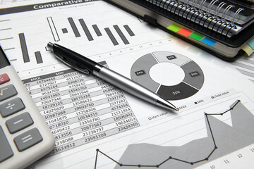 business office desk closeup - financial reports, analysis and accounting, set of documents, tables...