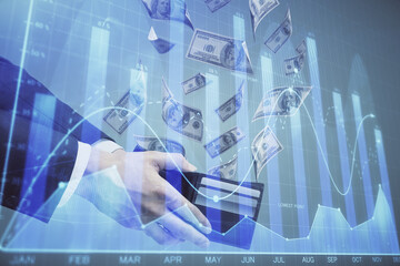Multi exposure of financial graph drawing hologram and USA dollars bills and man hands. Analysis concept.