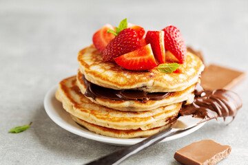 Freshmade pancakes served with strawberry and choco paste