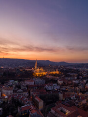 Aerial drone shot of Matthias Church on Buda hill during Budapest sunset