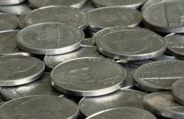 Silver Five Cent Nickels Scattered in a Pile