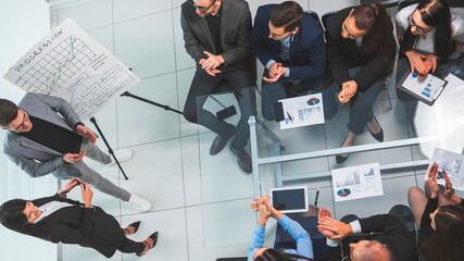 Obraz premium top view. the businesswoman begins a working meeting with the business tea