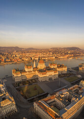 Aerial drone shot of Hungarian Parliament lights off before sunrise in Budapest dawn