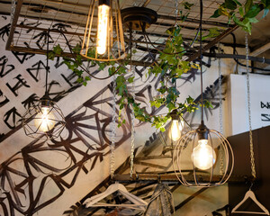 Fototapeta na wymiar Lamps lighting in Loft interior design. Selective focus.