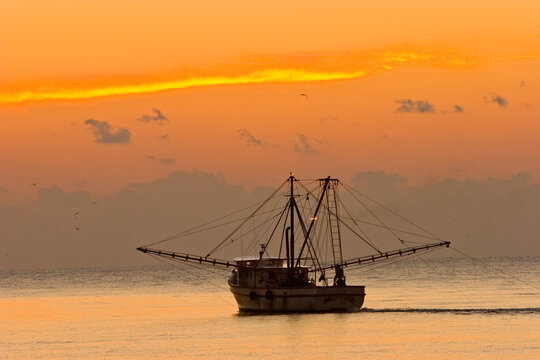 A shrimp boat off St Simons Island, Georgia at sunset.