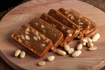 Peanut sorbet on a wooden background. Vegetarian  sweet with nuts.