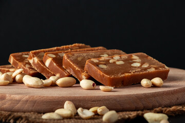 Peanut sorbet on a wooden background. Vegetarian  sweet with nuts.