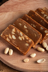 Peanut sorbet on a wooden background. Vegetarian  sweet with nuts.