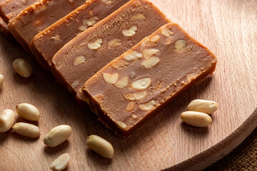 Peanut sorbet on a wooden background. Vegetarian  sweet with nuts.