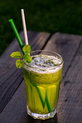 refreshing cucumber juice with mint on wood table