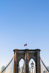 Fototapeta premium New York City, New York USA - September 21 2019 Brooklyn Bridge in New York city. Close up brownstone Brooklyn bridge.