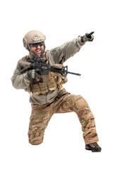 American ranger in military equipment and with a rifle aiming and shoots on a white background, portrait of a special forces soldier with weapons