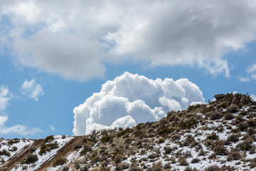 Huge puffy clouds over a desert landscape in Nevada