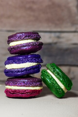 Colorful macaroons cookies shot in studio in front of vintage brick wall