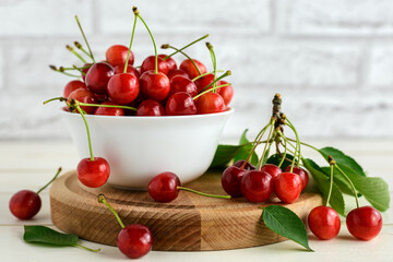 Fresh cherries in white bowl