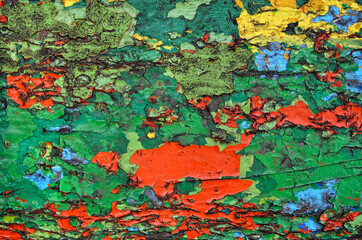 Texture of old, cracked, colorful paint on wood