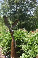 STATUE OF A BUNNY IN A GARDEN