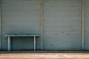 Fototapeta premium Metallic roller shutter door with desk