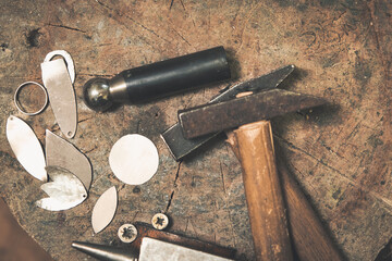 Still life of goldsmith's tools. Top view wood background