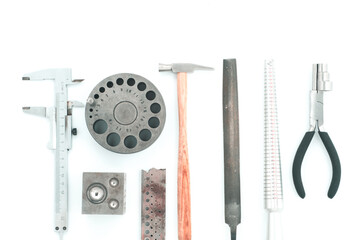 vintage jeweler tools and diamonds over working bench, blank business card for your text