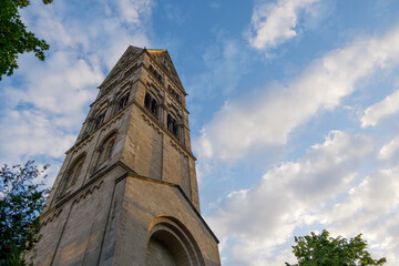Obraz premium Low angle view at the tower of Rochuskirche, Saint Rochus Catholic Church, in Düsseldorf, Germany against blue sky. 