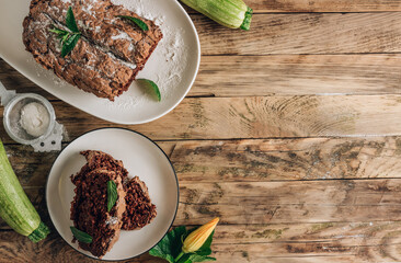 Vegan crunchy chocolate zucchini cake on rustic wooden. Healthy gluten free food.