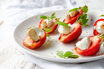 plate with fresh strawberry with cream cheese, balsamic vinegar