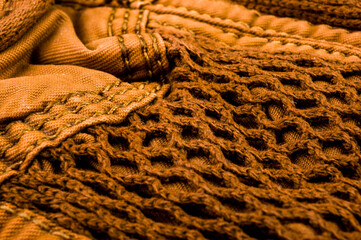 clothing items stonewashed cotton fabric texture with seams, clasps, buttons and rivets, macro