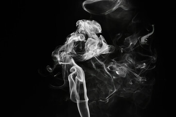 abstract fragment movement of white smoke on black background.