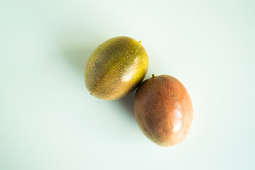 two ripe passion fruits isolated on white