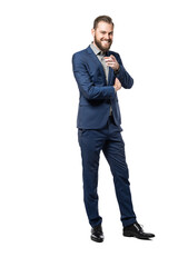 A full body picture of a happy caucasian male smiling and pointing at the camera, wearing a
blue suit standing against a white background.