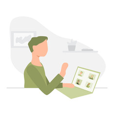 Man doing video meeting with colleagues at home on the laptop