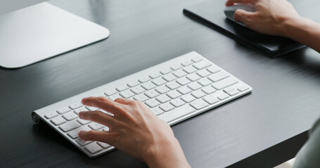 Woman type on computer keyboard