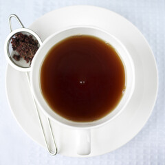 Tea leaves and a cup of tea