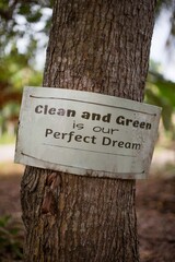 environmental conservation sign on a tree in the forest 