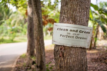 environmental conservation sign on a tree in the forest 